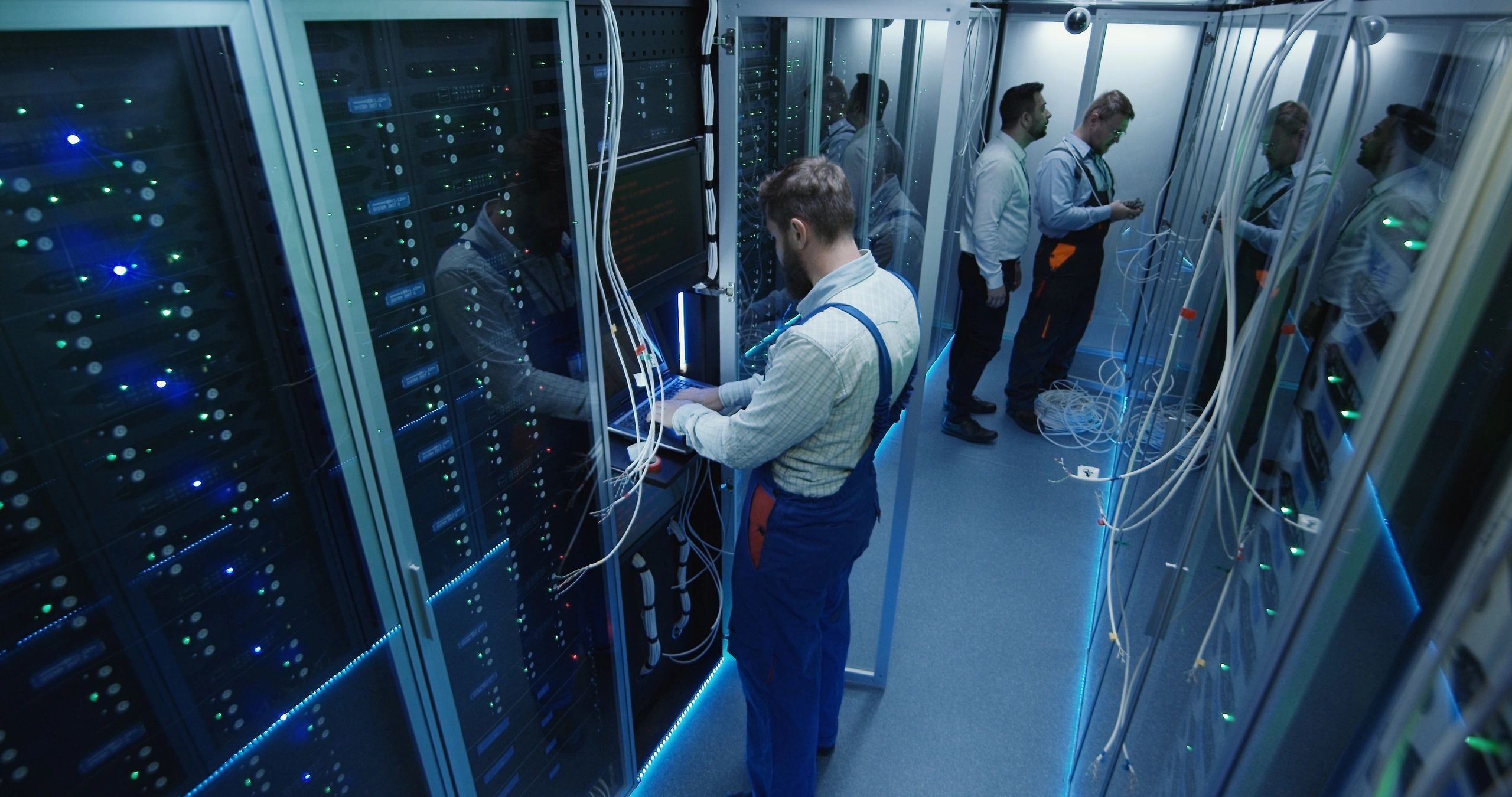 Technicians working in a server room