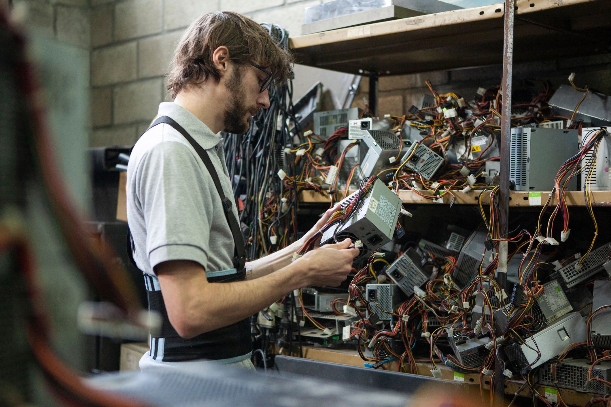 Technician checking computer hardware components